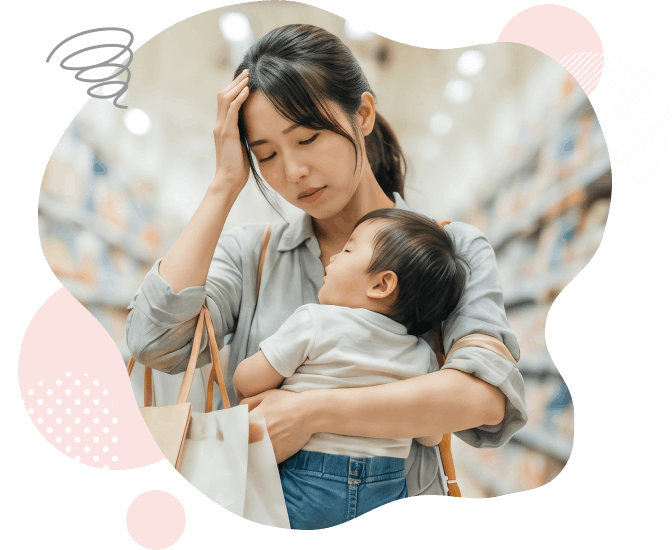 買い物中に子どもを抱っこして困っている女性